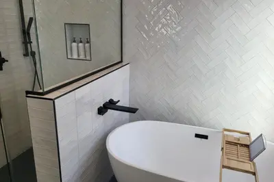 a bathroom with a white toilet and a shower at Modern Living in PHX Heated Pool Arizona Charm in Philadelphia