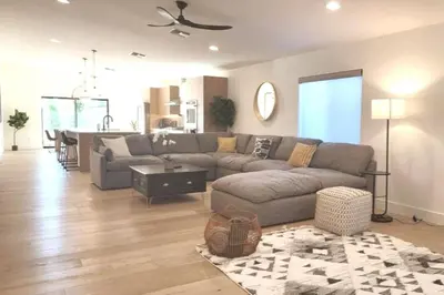 a living room with a couch and a table at Modern Living in PHX Heated Pool Arizona Charm in Philadelphia