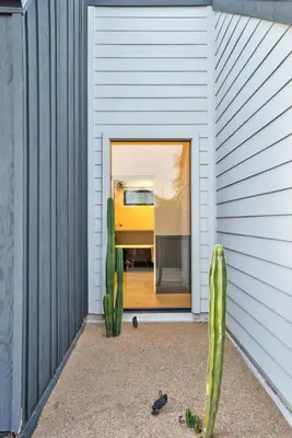 a cactus in front of a building with a door at Modern Home w Heated Pool in Philadelphia