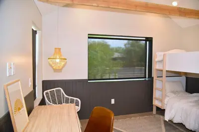 a bedroom with a bunk bed and a desk at Modern Home w Heated Pool in Philadelphia