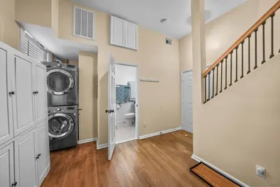 a laundry room with a washer and dryer at Free Parking -2BR,2Bath, 4Beds, Sleeps 6, 10 Min to NYC, 10 Min to Path in Hoboken