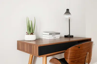 a desk with a lamp and a cactus on it at 73-812 New Studio UWS Doorman Gym in New York
