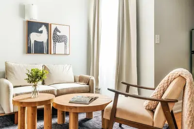 a living room with a couch and a table at 73-812 New Studio UWS Doorman Gym in New York