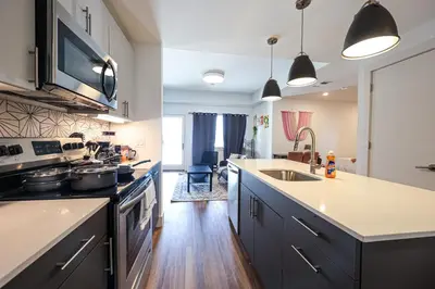 a kitchen with a sink and a stove top oven at Studio Apartment in the Heart of Philadelphia in Philadelphia