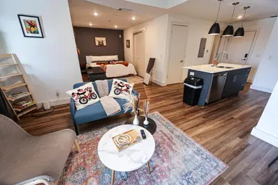 a living room with a couch and a table at Studio Apartment in the Philadelphia in Philadelphia