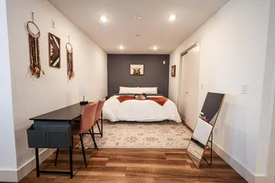 a bedroom with a bed and a desk at Studio Apartment in the Philadelphia in Philadelphia