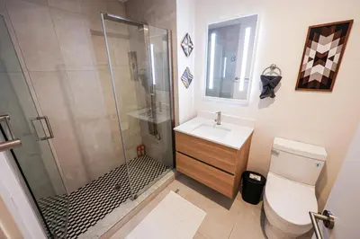 a bathroom with a shower and a toilet and a sink at Studio Apartment in the Philadelphia in Philadelphia