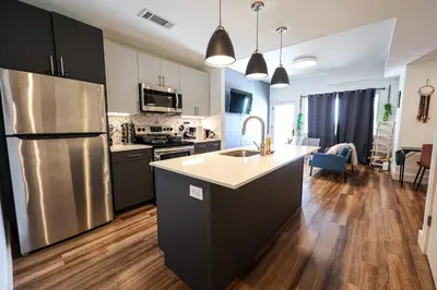 a kitchen with a stainless steel refrigerator and a counter at Studio Apartment in the Philadelphia in Philadelphia