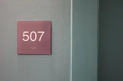 a pink sign on the side of a wall at StudioAprt QueenBed,WiFi,WD,Parking,Gym in Philadelphia