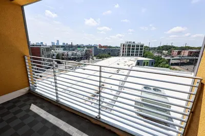 a balcony with a view of a city at StudioAprt QueenBed,WiFi,WD,Parking,Gym in Philadelphia
