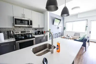 a kitchen with a sink and a counter top at StudioAprt QueenBed,WiFi,WD,Parking,Gym in Philadelphia