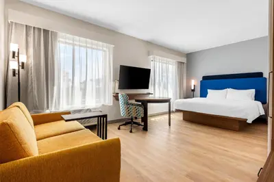 a hotel room with a bed and a desk and a couch at Hampton Inn & Suites Intercourse, Pa in Intercourse