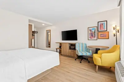 a hotel room with a bed and a desk and a tv at Hampton Inn & Suites Intercourse, Pa in Intercourse
