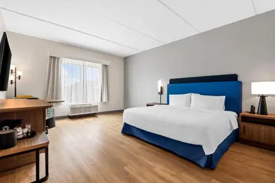 a hotel room with a bed and a television at Hampton Inn & Suites Intercourse, Pa in Intercourse