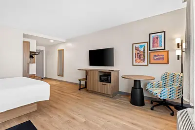 a hotel room with a bed and a flat screen tv at Hampton Inn & Suites Intercourse, Pa in Intercourse