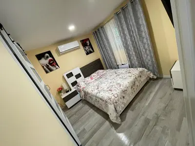 a small bedroom with a bed and a window at Gorgeous house private pool hot tub playroom in Long Pond