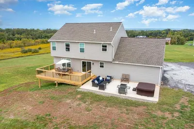 an aerial view of a house with a large deck at 10 Acre Hidden Gem in Dillsburg