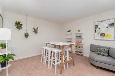a living room with a table and a couch at 10 Acre Hidden Gem in Dillsburg