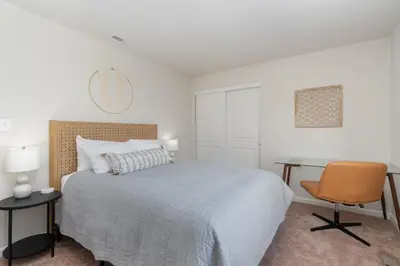a bedroom with a bed and a desk and a chair at 10 Acre Hidden Gem in Dillsburg