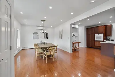 a kitchen and dining room with a table and chairs at Peaceful Paradise , Dream Holiday Home in Woodridge in Mountain Dale