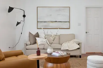 a living room with a couch and a table at Peaceful Paradise , Dream Holiday Home in Woodridge in Mountain Dale