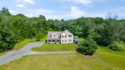 an aerial view of a large white house with a driveway at Peaceful Paradise , Dream Holiday Home in Woodridge in Mountain Dale