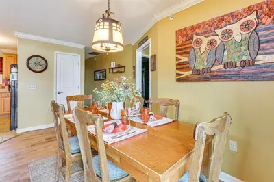 a dining room with a wooden table and chairs at Less Than 1 Mi to Mountain Creek Resort Condo with Balcony in Vernon Township
