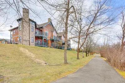 a large house on top of a hill with a driveway at Less Than 1 Mi to Mountain Creek Resort Condo with Balcony in Vernon Township