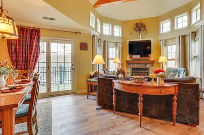 a living room with a couch and a table at Less Than 1 Mi to Mountain Creek Resort Condo with Balcony in Vernon Township