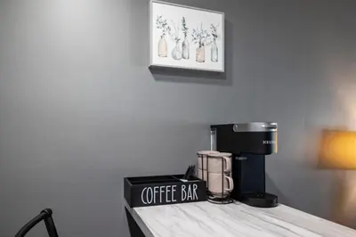 a coffee bar sitting on top of a counter at The Luxe Nook, Premier Studio in Scenic Congers in Congers