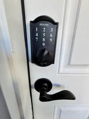 a clock on a door with a door knob at Cozy 1 BR, walk to subway, Free WiFi & Parking in Belleville