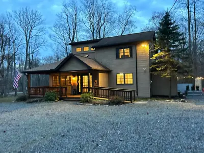 a house with a porch with lights on at EVPg in Lehigh