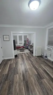 a living room with a christmas tree in a room at Serenity Haven in Irvington
