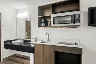 a kitchen with a sink and a microwave at Studio 6 King of Prussia PA Philadelphia in King of Prussia