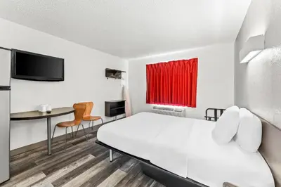 a room with a bed and a desk and a tv at Studio 6 King of Prussia PA Philadelphia in King of Prussia