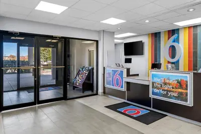 an office lobby with a waiting area with a sign at Studio 6 King of Prussia PA Philadelphia in King of Prussia