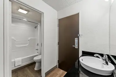 a bathroom with a sink and a toilet at Studio 6 King of Prussia PA Philadelphia in King of Prussia