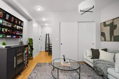 a living room with a couch and a table at Beautiful Apartment in NYC in New York