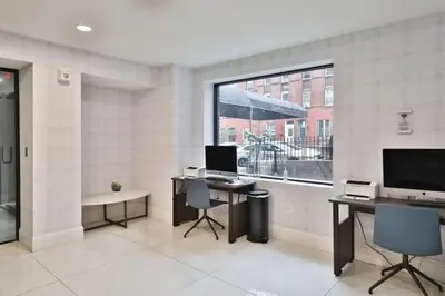 an office with two desks and a large window at Fairfax 126 I 1bd1bth University City in Philadelphia