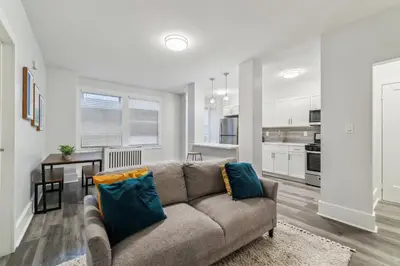 a living room with a couch and a kitchen at Fairfax 126 I 1bd1bth University City in Philadelphia