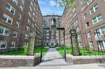 a street sign in front of a building at Fairfax Apartments 303 Spacious 1 Bed 1 Bth in Philadelphia