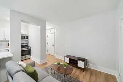 a living room with a couch and a table at Fairfax Apartments 604 Spacious 1 Bed 1 Bth in Philadelphia