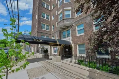 a building with awning in front of a building at Fairfax Apartments 604 Spacious 1 Bed 1 Bth in Philadelphia