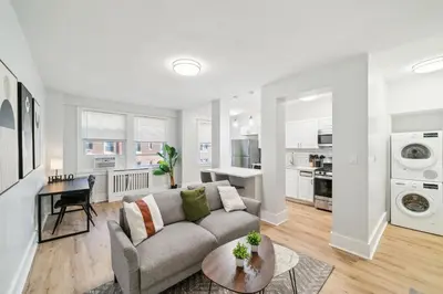 a living room with a couch and a table at Fairfax Apartments 604 Spacious 1 Bed 1 Bth in Philadelphia