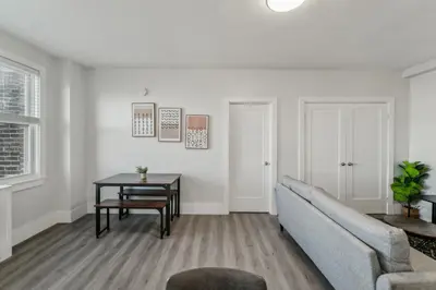 a living room with a couch and a table at Fairfax Apartments 725 Spacious 1 Bed 1 Bth in Philadelphia