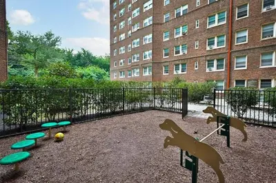 a playground with dogs and frisbees in front of a building at Fairfax Apartments 725 Spacious 1 Bed 1 Bth in Philadelphia
