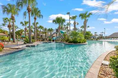 a pool at a resort with palm trees and a slide at MYR1456 in Philadelphia