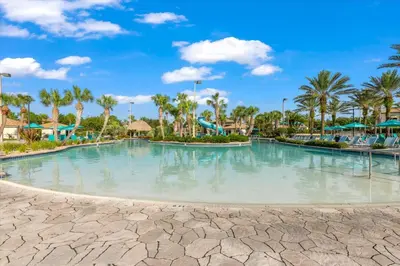 a large swimming pool at a resort with palm trees at MYR1456 in Philadelphia