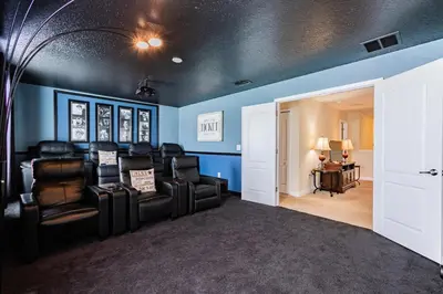 a room with leather chairs and a room with blue walls at MYR1466 in Philadelphia
