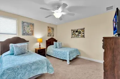 a bedroom with two beds and a ceiling fan at MYR1466 in Philadelphia